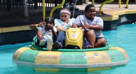 A grandfamily on a raft at a water attraction